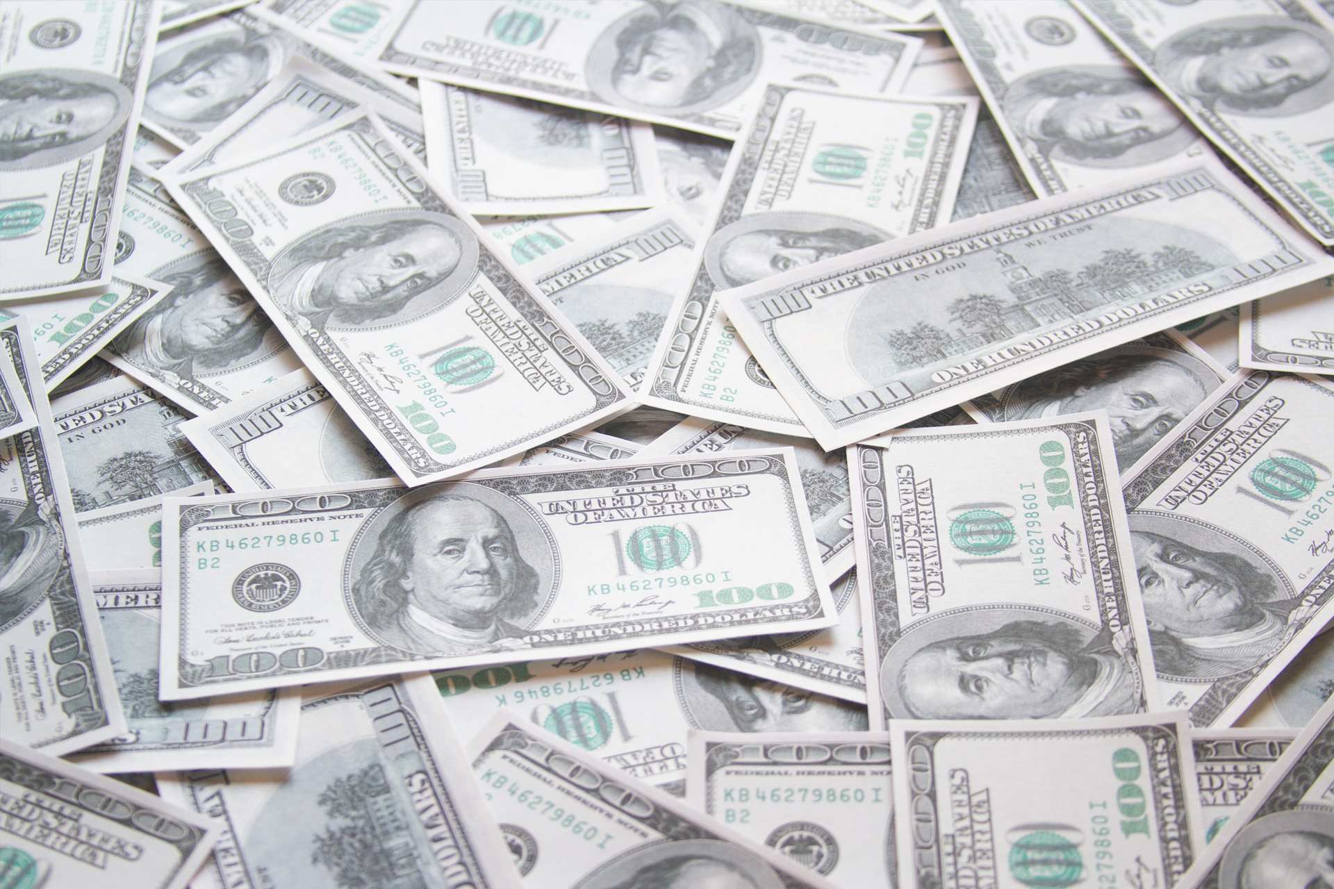 A spread of United States one-hundred-dollar bills